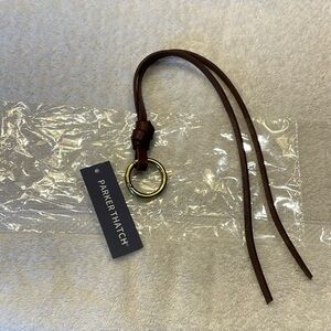 Parker Thatch long leather charm NWT